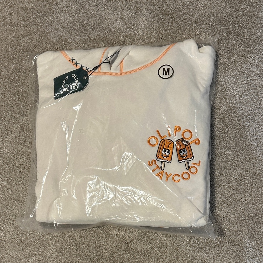 Olipop “Stay Cool” Cream Graphic Sweatshirt with Orange Popsicle Design